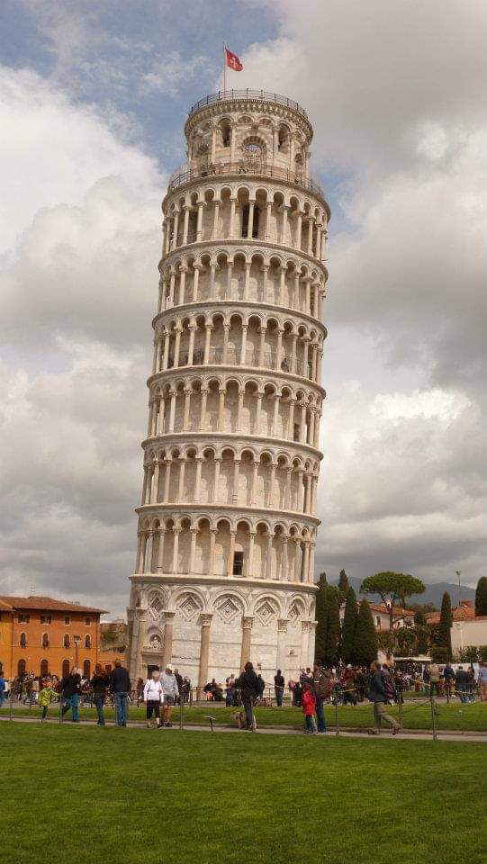 A leaning cylindrical tower of Romanesque architecture. Pisa, Italy